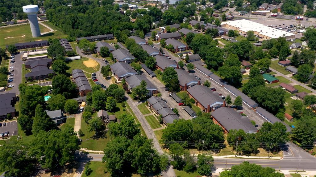 an aerial view of a neighborhood with houses and trees