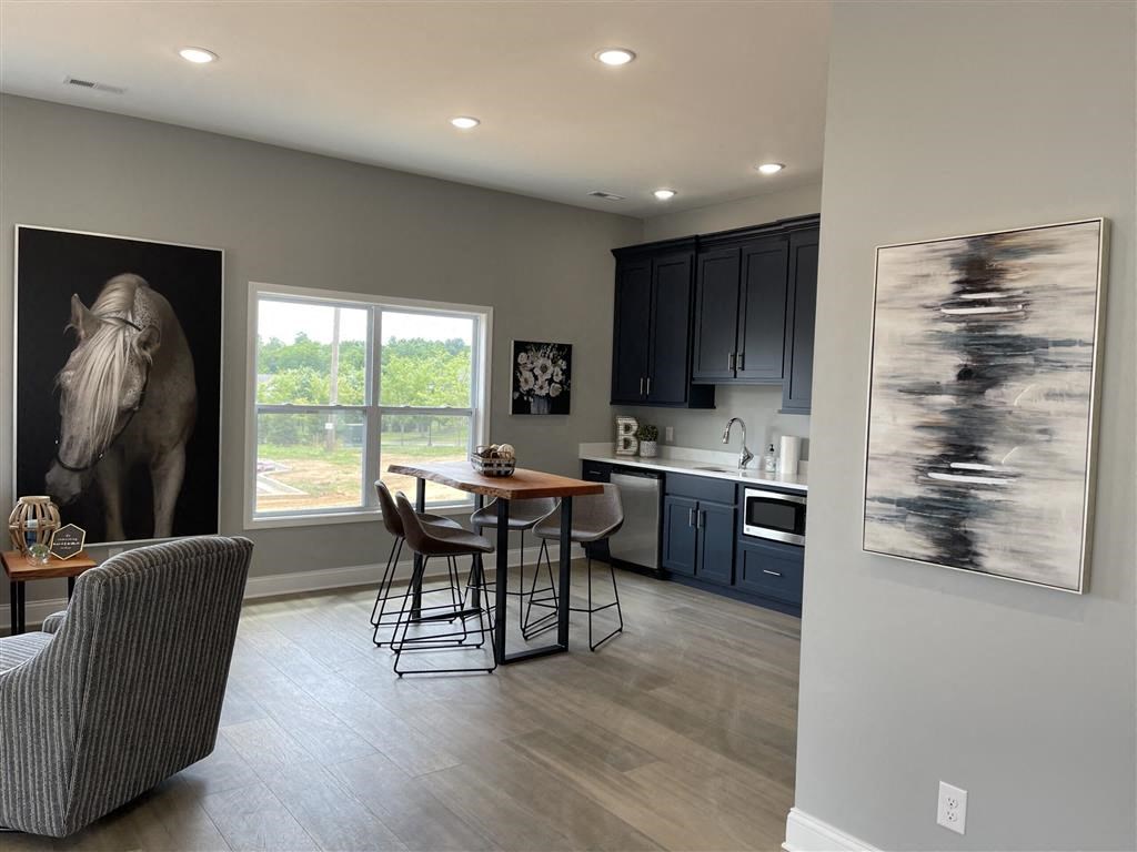 a kitchen and dining room with a table and chairs