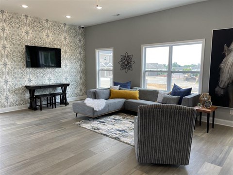 a living room with a couch and a chair