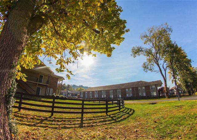 a wooden fence in front of a building