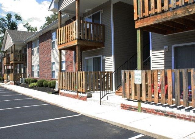 a building with a wooden fence in front of it