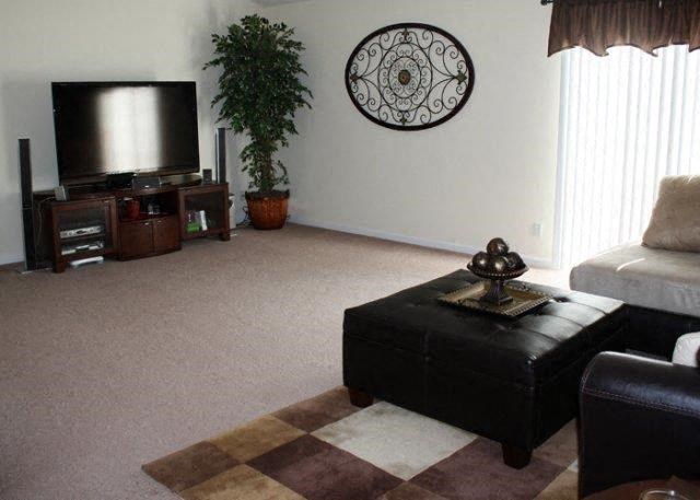 a living room with a couch and a television