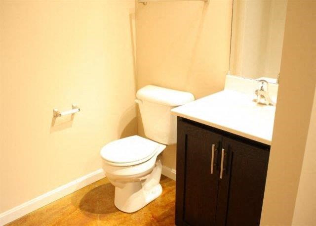 a bathroom with a toilet and a sink