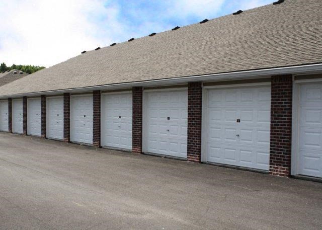 a row of garage doors on the side of a building