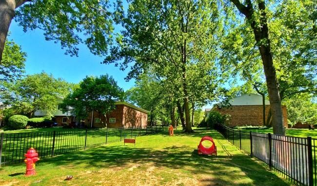 a yard with a red tent and a fire hydrant