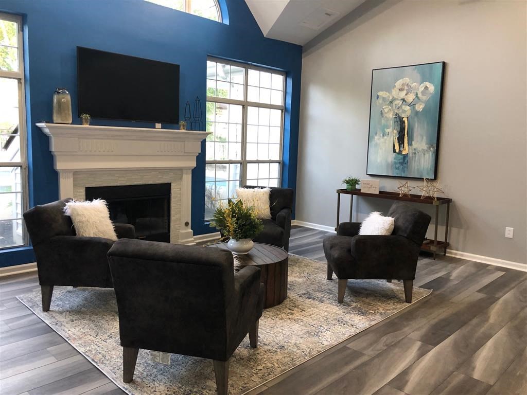 a living room with blue walls and a fireplace