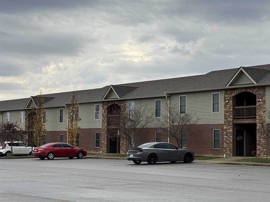 a building with cars parked in front of it