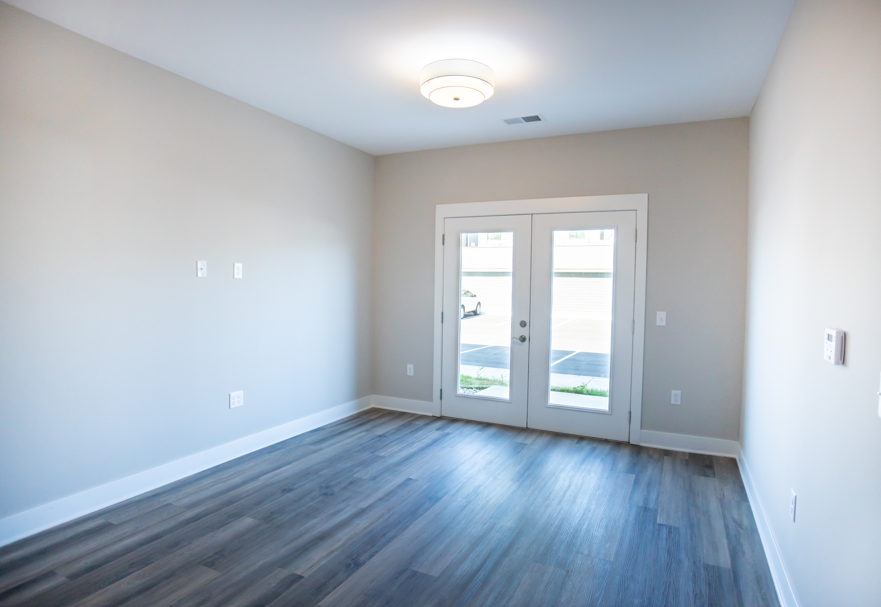 A room with a sliding door and a window.