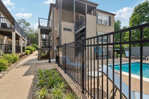 An apartment pool with black fence in Louisville