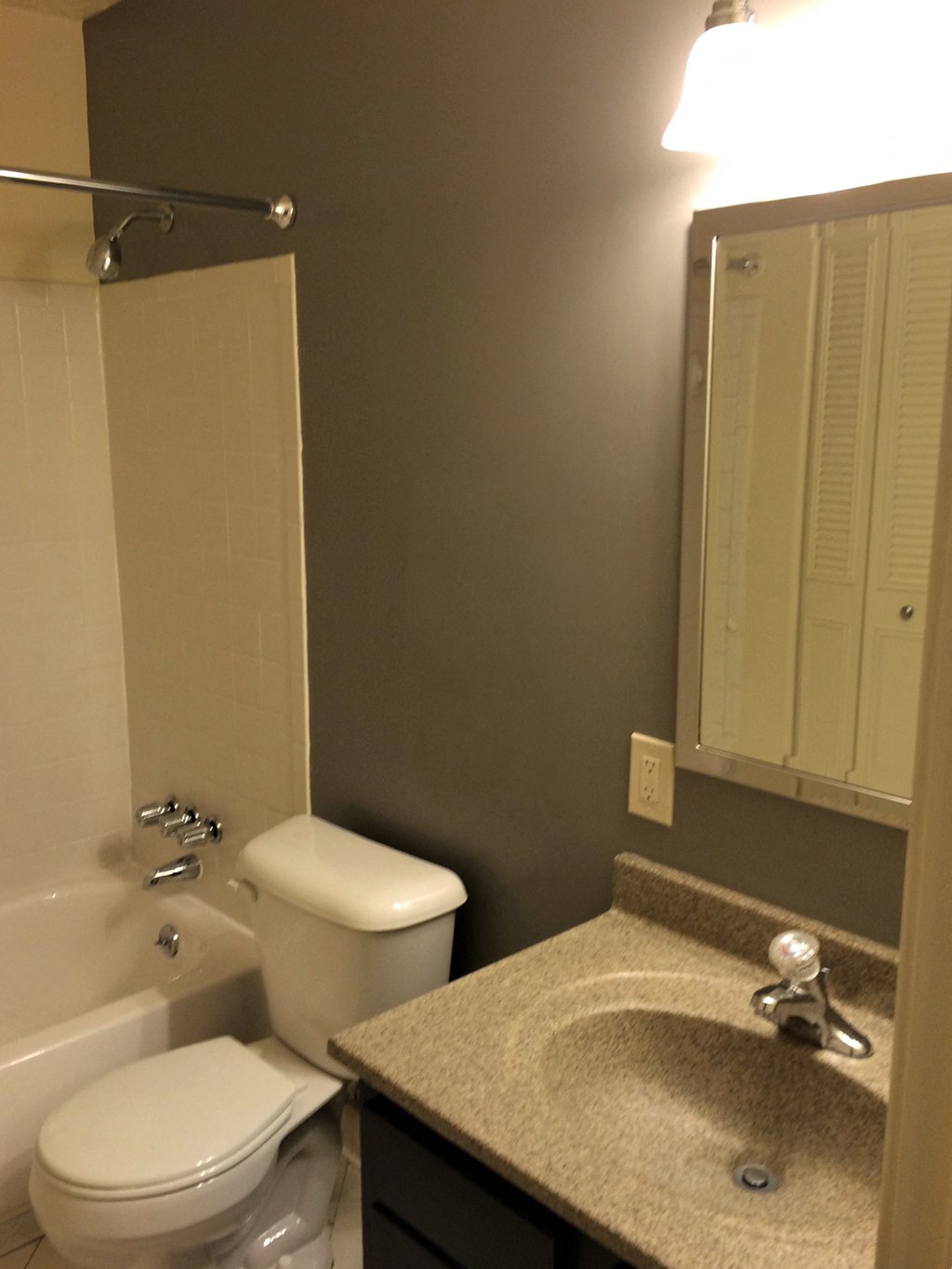 a small bathroom with a sink toilet and shower
