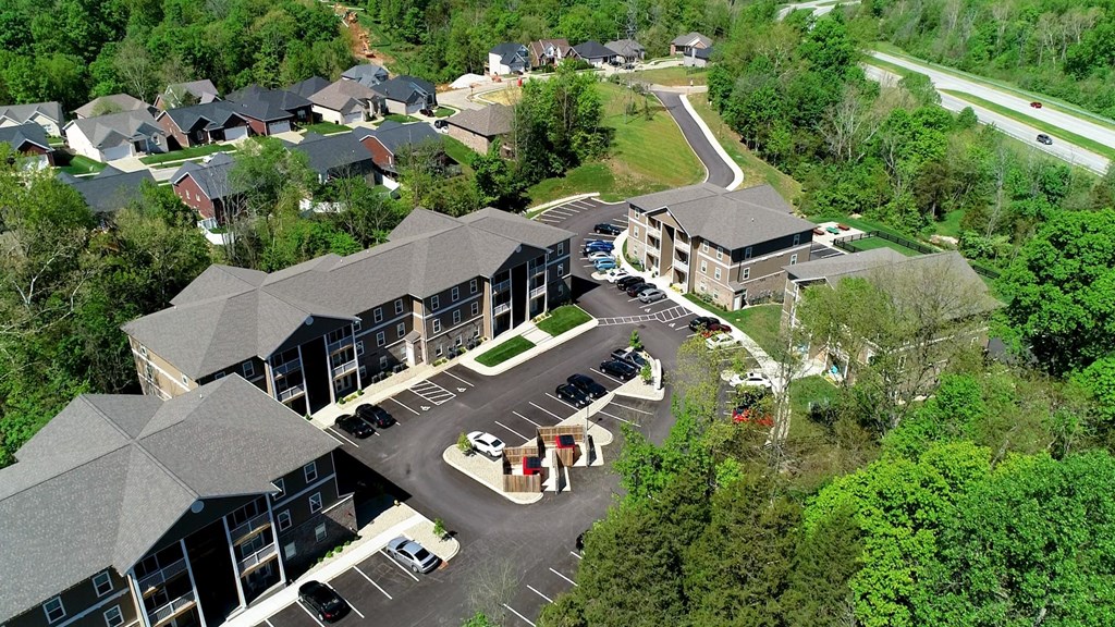 arial view of a large apartment complex with a parking lot