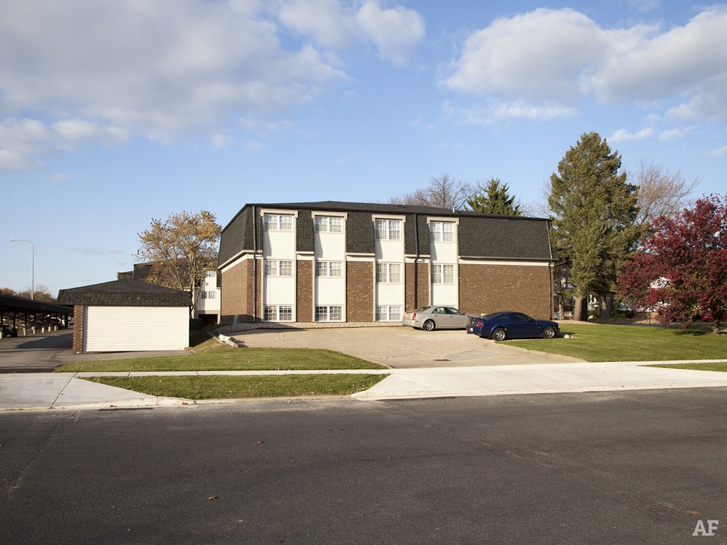 a large brick building with a street in front of it