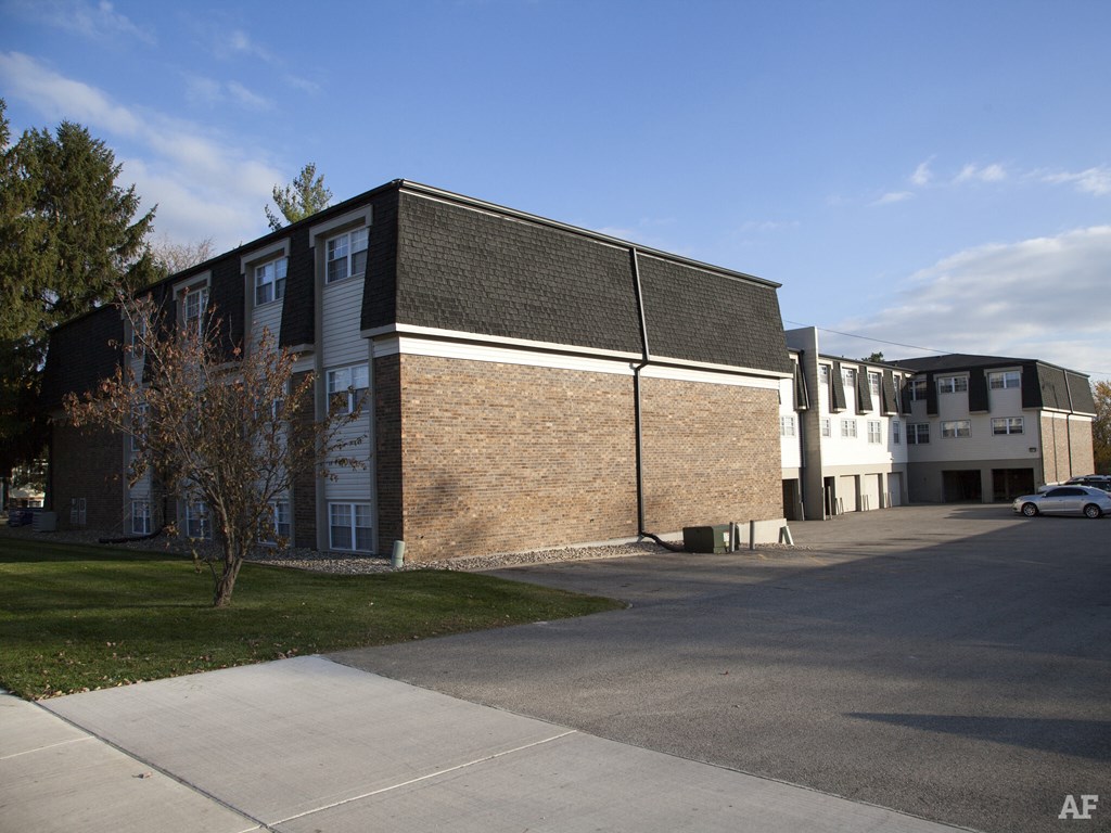 a brick building with a street in front of it