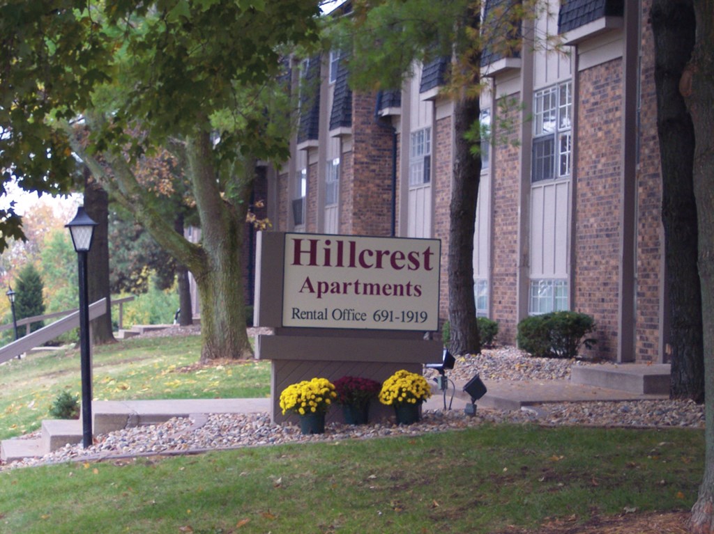 the front of a building with a sign for hillside apartments