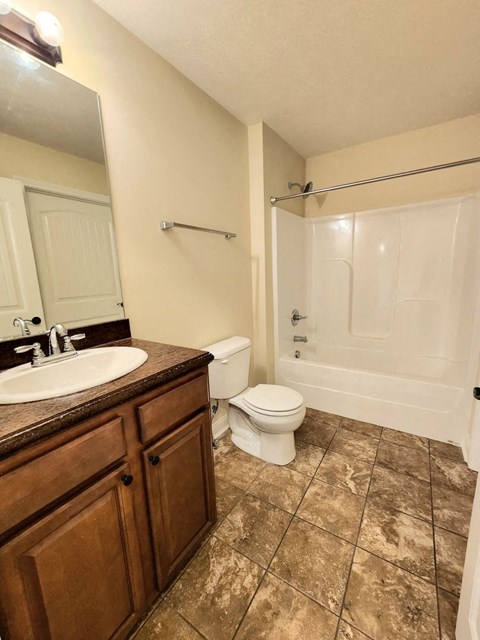 a bathroom with a sink toilet and a shower