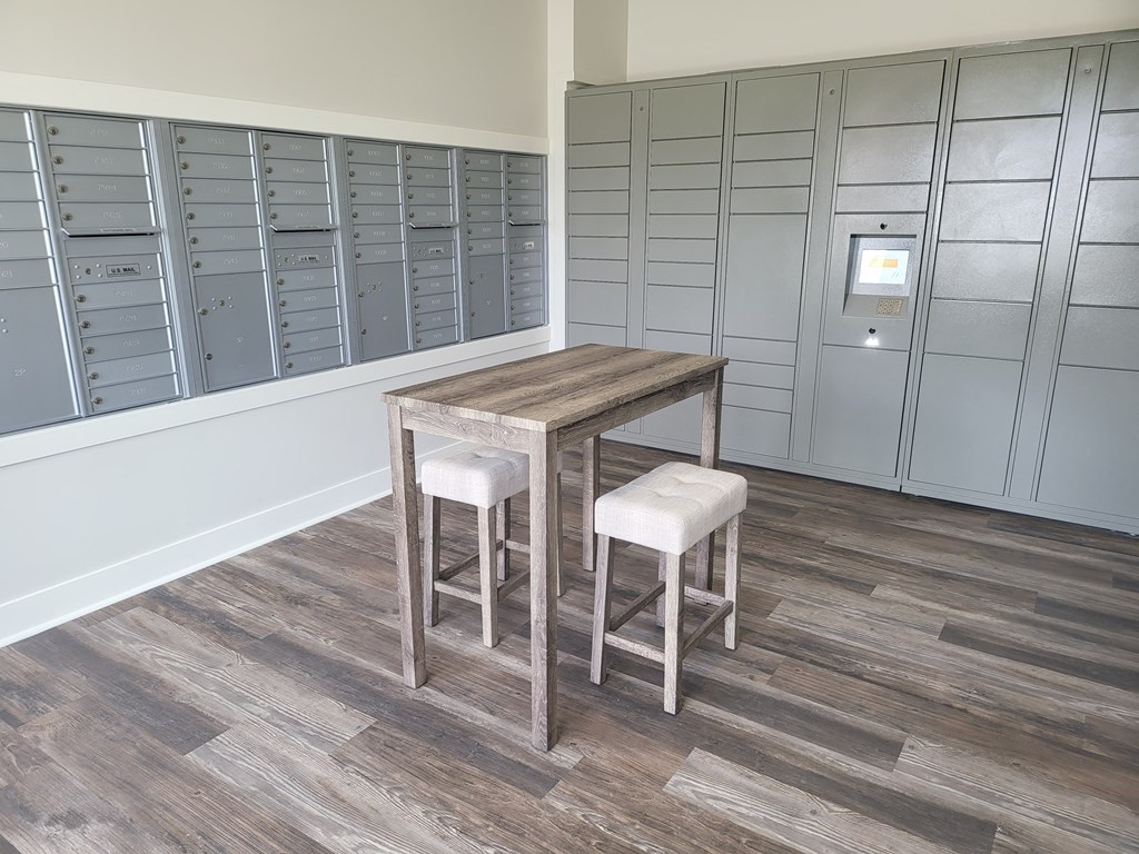 a pair of stools in a locker room with two tables
