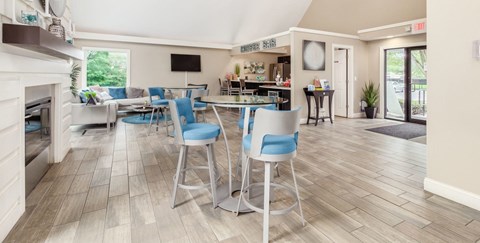 Table with two chairs in apartment community lounge
