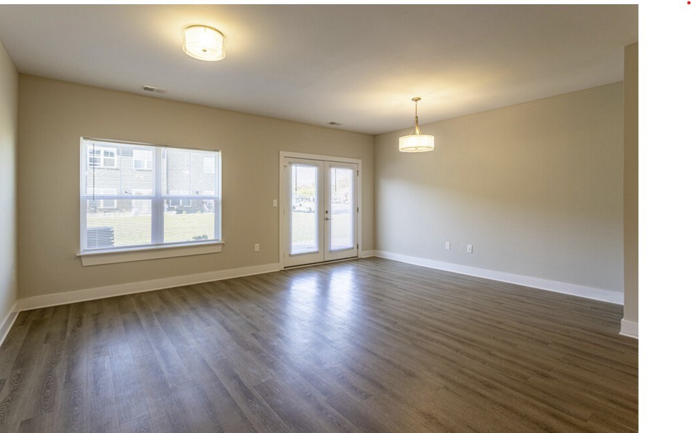 A room with a window and a door is shown.