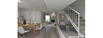 A modern living room with a dining table and chairs.