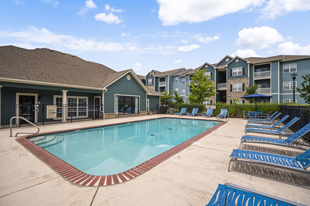 Pool With Lounge Chairs at Aventura at Richmond, St. Peters, Missouri