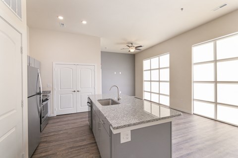 a kitchen with stainless steel appliances and a granite counter top