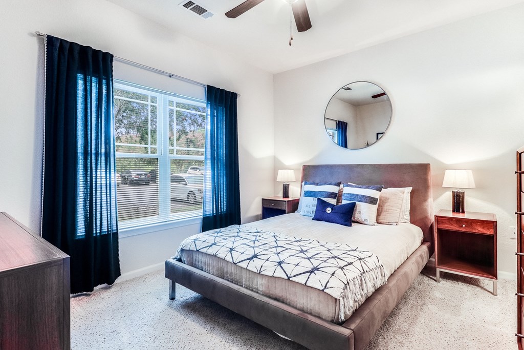 a bedroom with a bed and nightstand at Plantation Crossing, Louisiana