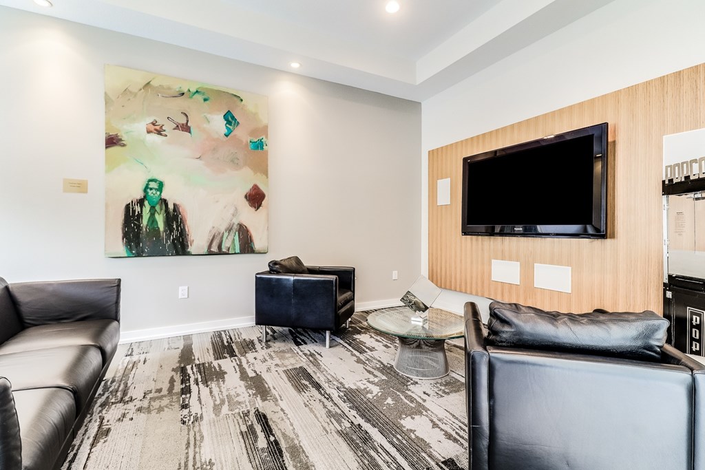 A living room with a large painting on the wall and a flat screen TV, Plantation Crossing, Lafayette, LA, 70508