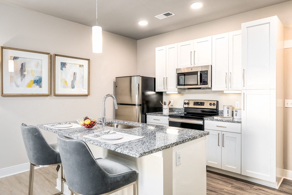 Gourmet Kitchen With Island at The Edison at Bridlespur, Kansas City