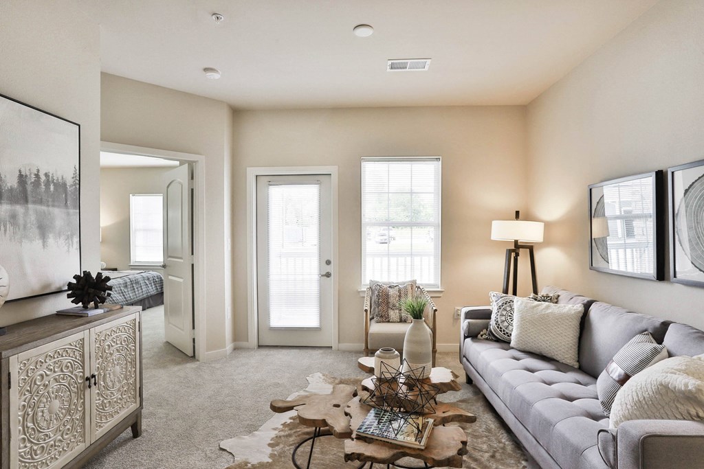 a living room with a couch and a coffee table at Aventura at Hawk Ridge, Lake St Louis, 63367