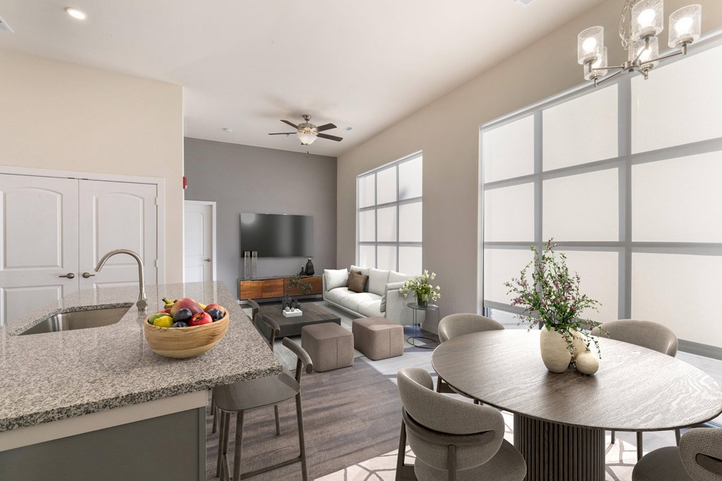 A modern kitchen with a dining table and chairs.