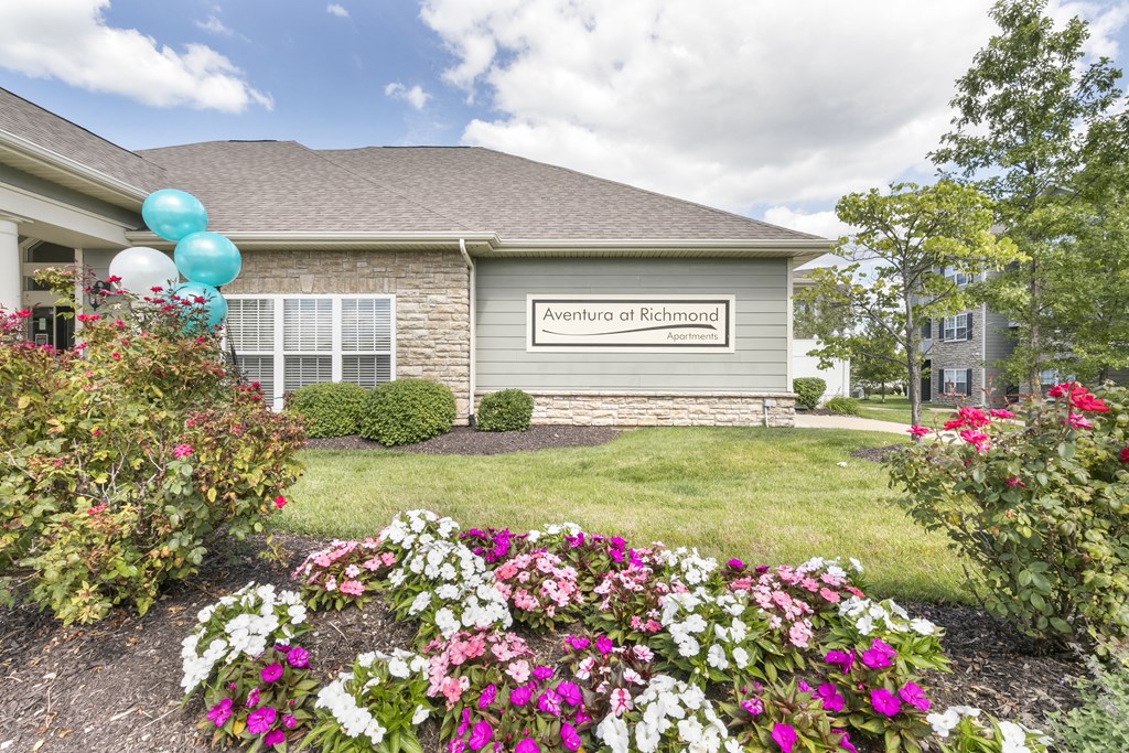 a house with flowers in front of it  at Aventura at Richmond, St. Peters, MO