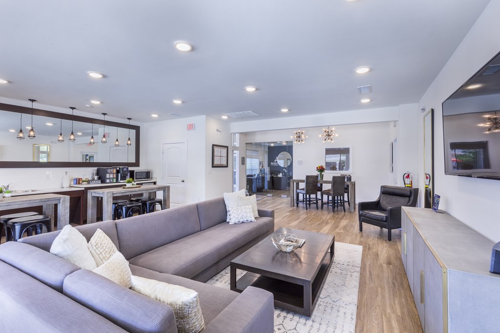 a living room with a couch and a table at Aventura at Towne Centre, Ellisville, MO