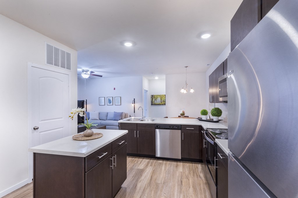a kitchen with stainless steel appliances and a stainless steel refrigerator at Aventura at Towne Centre, Ellisville