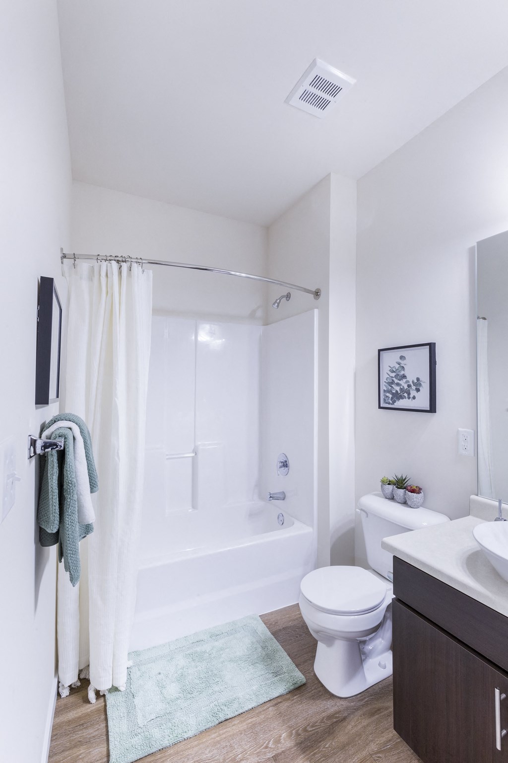 a bathroom with a shower and a toilet and a sink at Aventura at Towne Centre, Ellisville, 63011