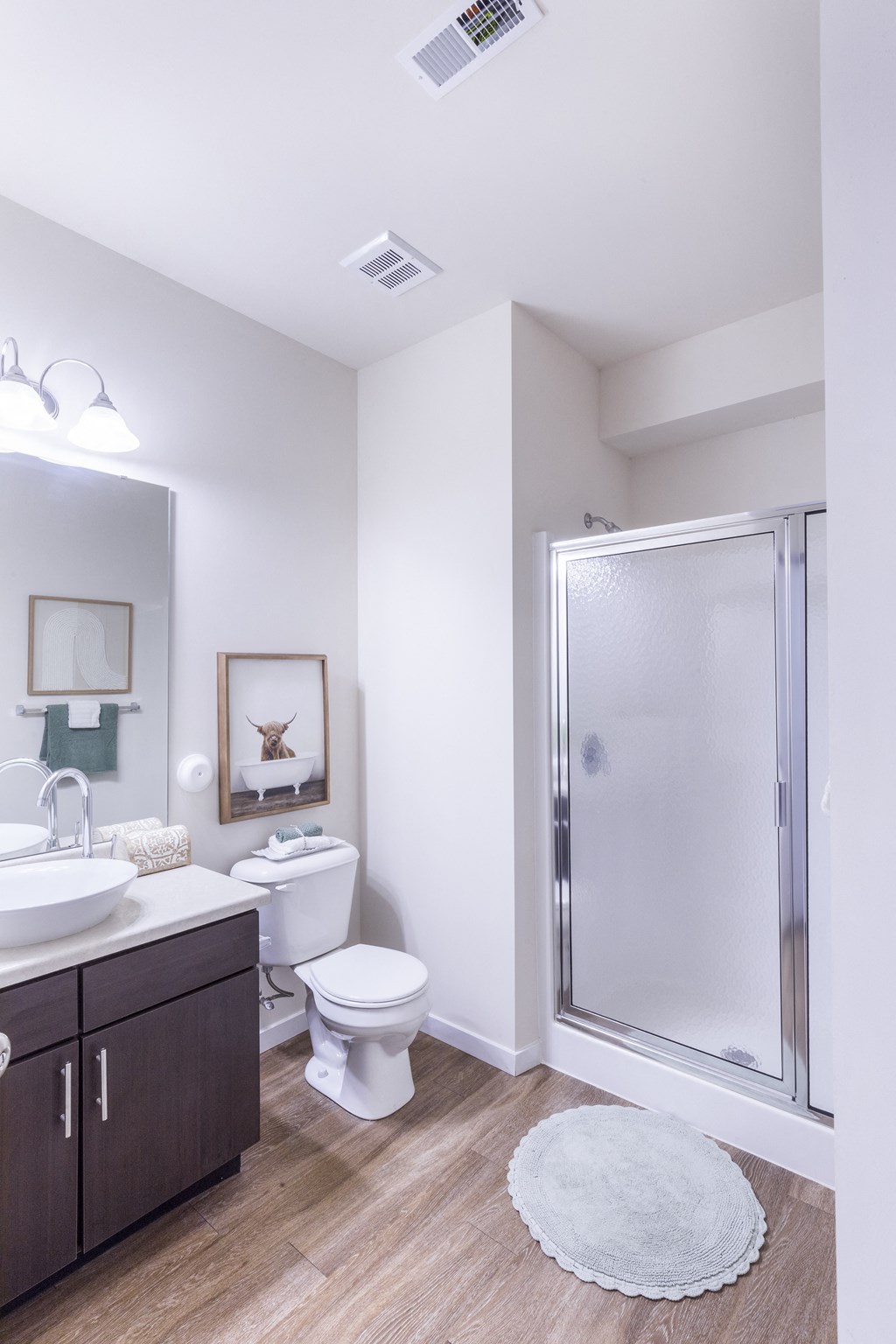 a bathroom with a shower and a toilet and a sink at Aventura at Towne Centre, Missouri, 63011