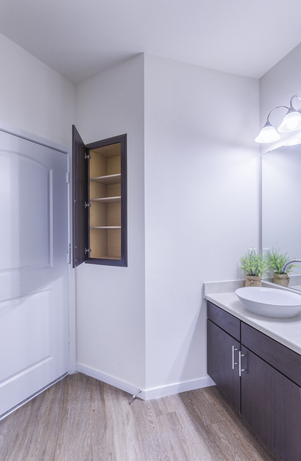 a bathroom with a sink and a shower and a mirror at Aventura at Towne Centre, Ellisville
