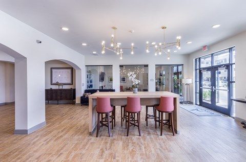 a dining room with a large table and chairs at Aventura at Wild Horse Creek, Missouri, 63017
