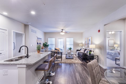 a spacious living room with a kitchen and a living room at Aventura at Wild Horse Creek, Chesterfield, MO, 63017