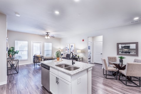 a spacious living room with a kitchen and a dining room at Aventura at Wild Horse Creek, Chesterfield