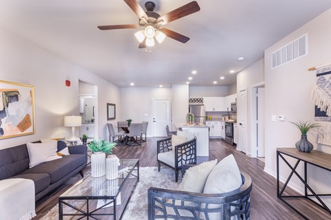 a living room with couches and a glass coffee table at Aventura at Wild Horse Creek, Chesterfield, MO