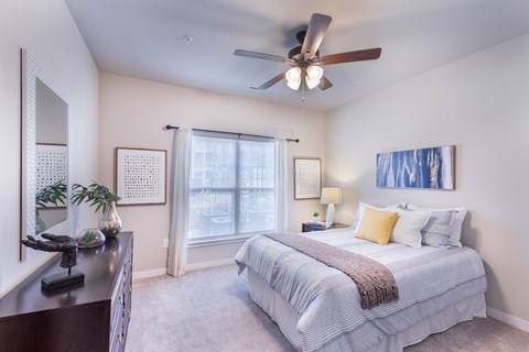 a bedroom with a bed and a ceiling fan at Aventura at Wild Horse Creek, Chesterfield