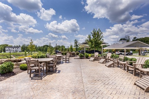 the outdoor patio at the preserve at great pond apartments in windsor ct at Aventura at Wild Horse Creek, Chesterfield, MO