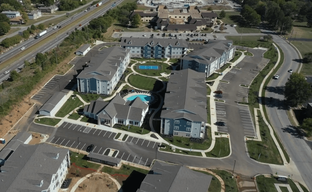 an aerial view of a group of houses in a neighborhood at The Edison at Blue Springs, Blue Springs
