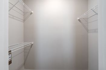 Empty white shelves in a room at Aventura at Wentzville I & II Apartments, Wentzville, Missouri