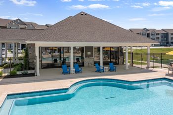 A pool with a building in the background at Aventura at Wentzville I & II Apartments, Wentzville, 63385