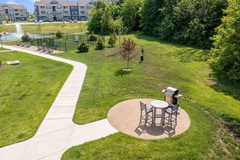 A park with a picnic table and a walking path at Aventura at Wentzville I & II Apartments, Wentzville, MO, 63385
