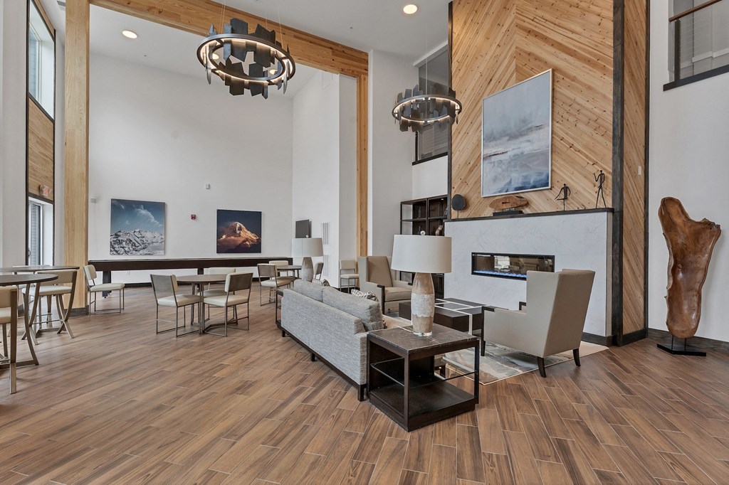 a living room filled with furniture and a fire place  at The Edison at Chapel Hills, Colorado Springs