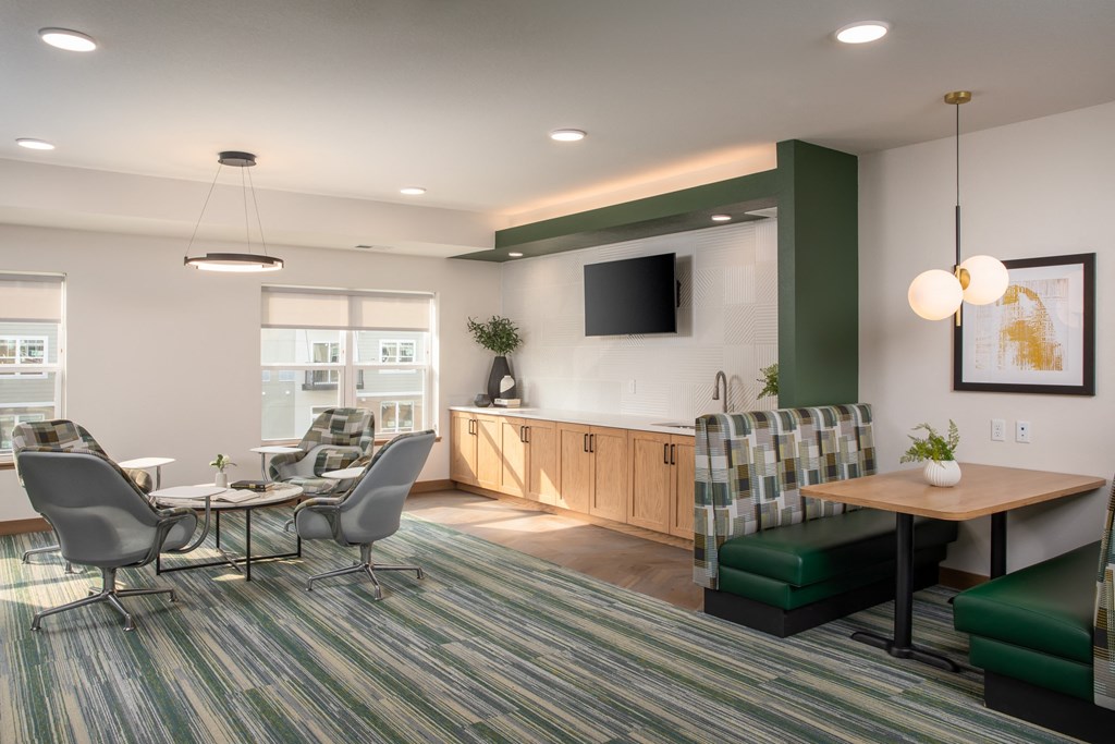 a room filled with furniture and a flat screen tv at The Edison at Rice Creek, Shoreview, 55126