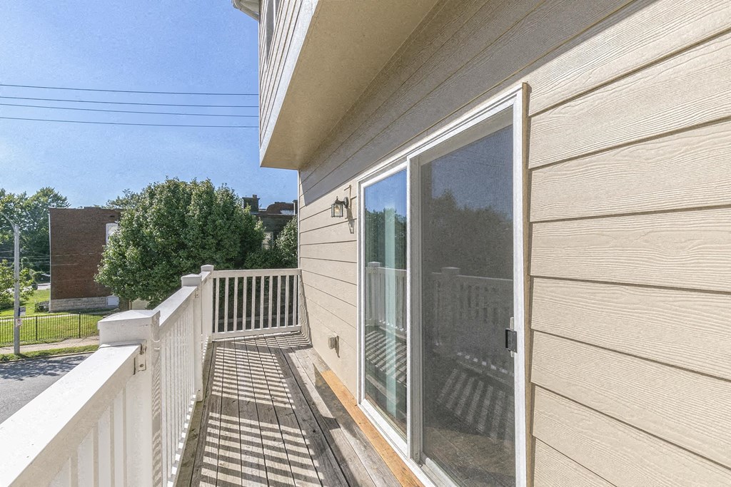 the view from the deck of a home with a large window