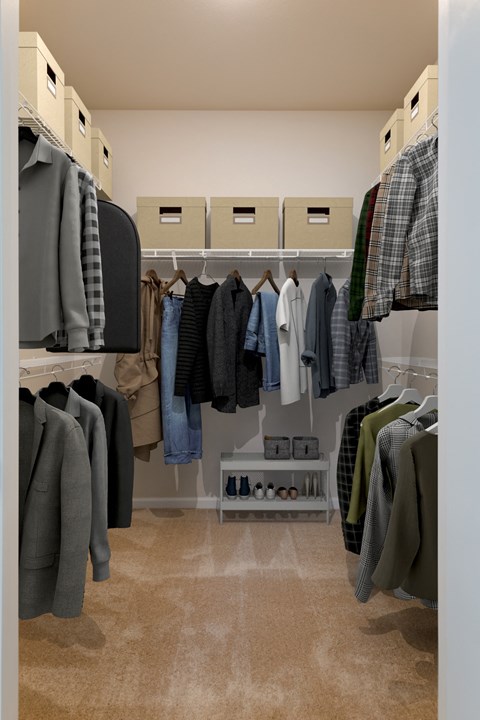a closet with a lot of clothes and shelves in it